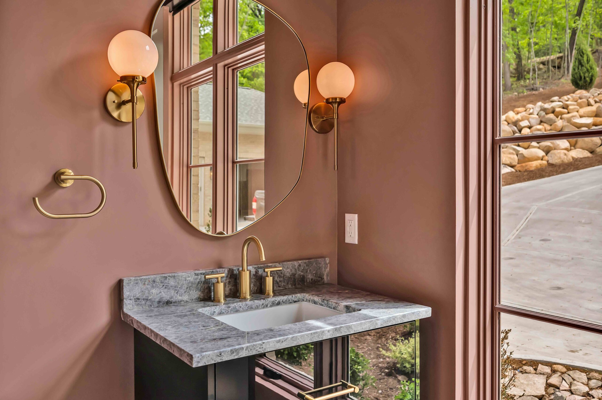 Pink bathroom with mirror and vanity