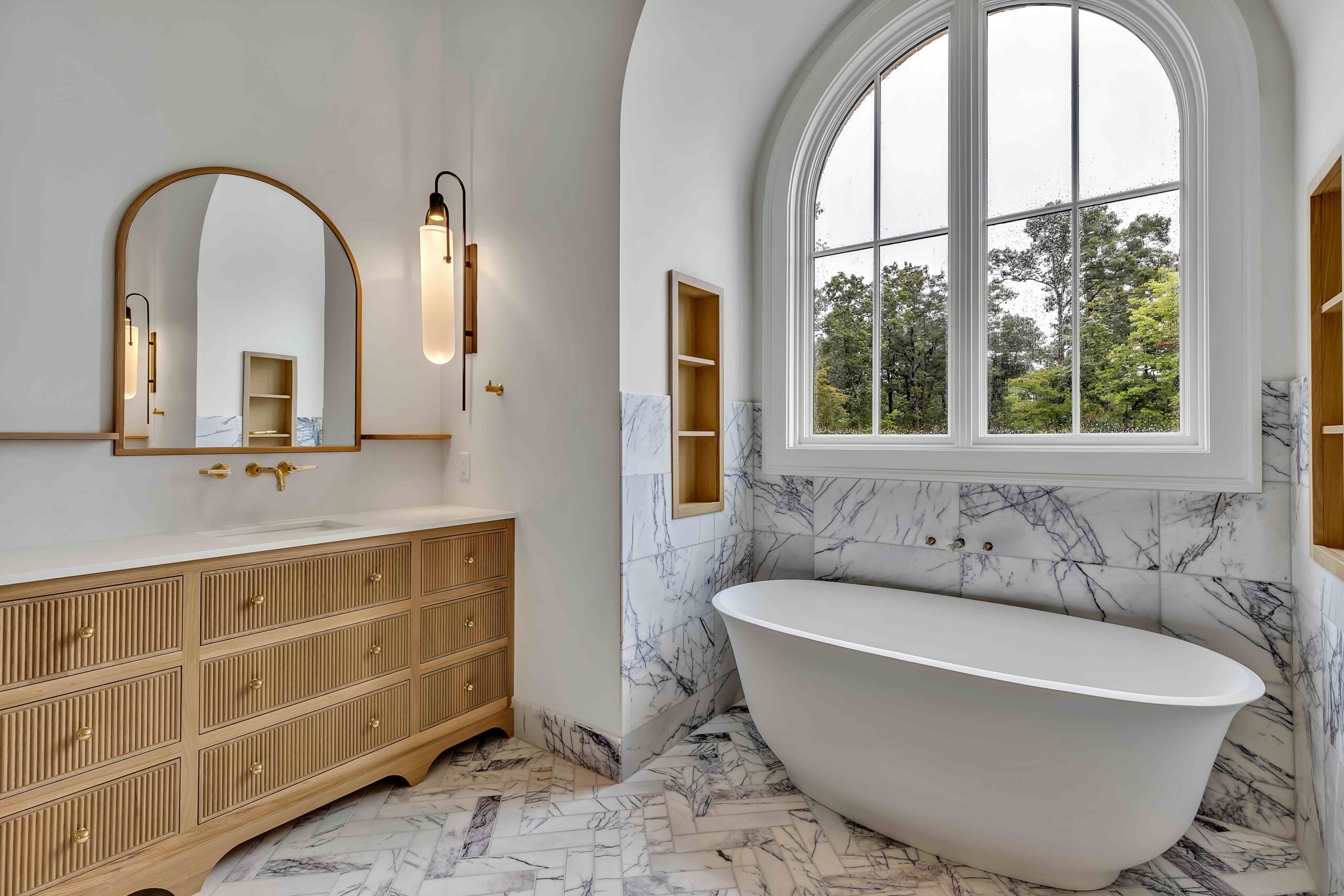 bathroom with vanity, mirror and free standing tub