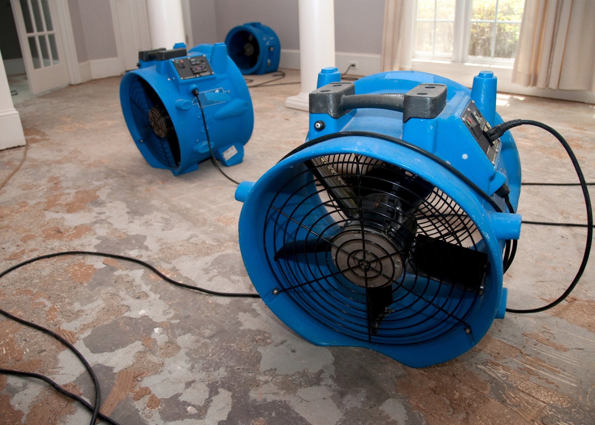 giant fans drying out floor after a flood